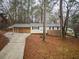 Charming single-story home with carport and mature trees at 3564 Sage Dr, Lithia Springs, GA 30122