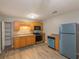 Functional kitchen with wood cabinets and modern stainless steel appliances at 3564 Sage Dr, Lithia Springs, GA 30122