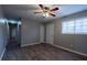 Open living room with a ceiling fan, wood-look flooring, and neutral color palette at 3564 Sage Dr, Lithia Springs, GA 30122