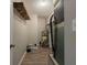 Functional utility room featuring shelving and modern water heater at 3564 Sage Dr, Lithia Springs, GA 30122