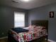 Comfortable bedroom features large window, neutral walls, and carpet free floors at 6051 Wintergreen Rd, Norcross, GA 30093