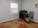 Carpet free bedroom with neutral walls and a large window providing natural light at 6051 Wintergreen Rd, Norcross, GA 30093