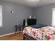Spacious bedroom featuring two windows, neutral walls, and carpet free floors at 6051 Wintergreen Rd, Norcross, GA 30093