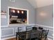 Open dining area with a view into the modern kitchen at 6051 Wintergreen Rd, Norcross, GA 30093