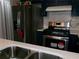 Updated kitchen features stainless steel refrigerator and gas range at 6051 Wintergreen Rd, Norcross, GA 30093