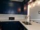 Beautiful kitchen with modern lighting, countertops and cabinetry at 6051 Wintergreen Rd, Norcross, GA 30093