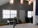 Bright eat-in kitchen featuring modern lighting, large windows, and dark wood table at 6051 Wintergreen Rd, Norcross, GA 30093