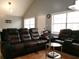 Comfortable living room featuring leather furniture and natural light at 6051 Wintergreen Rd, Norcross, GA 30093
