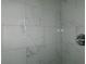 Sleek shower with modern marble style tiles and silver shower head at 6051 Wintergreen Rd, Norcross, GA 30093