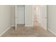 Bedroom with closet and neutral colored walls and carpeting at 811 Lake Chase, Fairburn, GA 30213