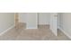 Bedroom with neutral carpeting, base trim and door frames, ready for personalization at 811 Lake Chase, Fairburn, GA 30213
