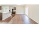 Open concept floor plan combining the kitchen and dining area with hardwood flooring at 811 Lake Chase, Fairburn, GA 30213