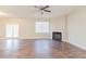 Spacious living room with wood floors, a fireplace, and access to the outdoors at 811 Lake Chase, Fairburn, GA 30213