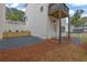 Backyard showing gravel area, pine straw and a small balcony at 826 Gaston Street Sw, Atlanta, GA 30310