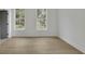 Bright bedroom features wood floors and two windows at 826 Gaston Street Sw, Atlanta, GA 30310