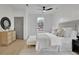 Bright, stylish bedroom features wood floors, neutral rug, panelled wall detail, and furniture at 826 Gaston Street Sw, Atlanta, GA 30310