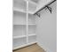 Walk-in closet featuring white shelving and hanging rod at 826 Gaston Street Sw, Atlanta, GA 30310