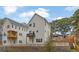 New construction showcasing white siding, multi-story balconies, and tiered landscaping at 826 Gaston Street Sw, Atlanta, GA 30310