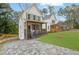 Charming two-story home with a landscaped yard, covered porch, and a paved driveway at 826 Gaston Street Sw, Atlanta, GA 30310