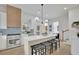 Spacious kitchen with a large center island, bar stool seating, and modern appliances in a bright space at 826 Gaston Street Sw, Atlanta, GA 30310