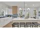 Beautiful kitchen with white cabinets, a center island with seating, stainless steel appliances, and ample counter space at 826 Gaston Street Sw, Atlanta, GA 30310