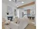 Bright living room with fireplace, modern lighting, and open view to the kitchen at 826 Gaston Street Sw, Atlanta, GA 30310