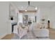 Bright living room with fireplace, modern lighting, and open view to the kitchen at 826 Gaston Street Sw, Atlanta, GA 30310