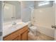 Well-lit bathroom with a tub-shower combo and vanity at 104 Shadow Creek Ct, Fairburn, GA 30213