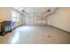 Spacious garage with two bays, automatic door openers, concrete floor and large window at 104 Shadow Creek Ct, Fairburn, GA 30213