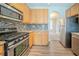 Contemporary kitchen with stainless steel appliances, stylish backsplash, and ample counter space at 104 Shadow Creek Ct, Fairburn, GA 30213