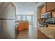 Well-equipped kitchen with granite countertops, stainless steel appliances, and modern finishes at 104 Shadow Creek Ct, Fairburn, GA 30213