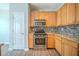 Charming kitchen featuring wood cabinets, stainless steel oven and stylish countertop at 104 Shadow Creek Ct, Fairburn, GA 30213