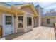 A wooden backyard deck is attached to the house at 110 Eastfield Ct, Mcdonough, GA 30252