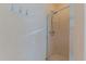 A clean bathroom featuring a glass enclosed shower and coat hooks at 110 Eastfield Ct, Mcdonough, GA 30252