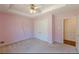 Bedroom view showcasing carpeted floors and a closet, with an attached doorway to a bathroom at 110 Eastfield Ct, Mcdonough, GA 30252