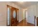 Foyer with hardwood floors, a stained-glass front door, and a view of the upper level at 110 Eastfield Ct, Mcdonough, GA 30252