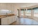 Bright eat-in kitchen with wood floors and large windows overlooking the backyard at 110 Eastfield Ct, Mcdonough, GA 30252