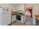 Efficient kitchen layout featuring white cabinets and modern appliances, perfect for meal preparation at 110 Eastfield Ct, Mcdonough, GA 30252
