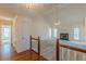 Bright living room with vaulted ceiling, fireplace, and access to hallway and entry, creating an inviting space at 110 Eastfield Ct, Mcdonough, GA 30252