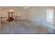 Large living room is bright and open with adjacent rooms visible at 110 Eastfield Ct, Mcdonough, GA 30252