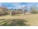 Expansive yard featuring mature trees and an open space, creating a serene and private outdoor setting at 110 Eastfield Ct, Mcdonough, GA 30252