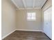 Bedroom featuring wood floors, a closet, and natural light at 1584 Belva Ave, Decatur, GA 30032