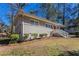 This exterior shot shows the brick facade and covered front entry of this charming ranch at 1584 Belva Ave, Decatur, GA 30032