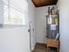 Laundry room featuring a window and water heater at 1584 Belva Ave, Decatur, GA 30032