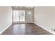 Bright, spacious living room features wood floors and a large window that provides plenty of light at 1584 Belva Ave, Decatur, GA 30032