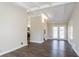 View of the main living area with views to the kitchen and outdoor area with French doors at 1584 Belva Ave, Decatur, GA 30032
