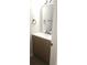 Bathroom featuring a modern vanity, a large mirror, and neutral decor at 5582 Windwood Rd, Atlanta, GA 30349