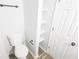 Bathroom features a toilet, storage, and shelves at 5582 Windwood Rd, Atlanta, GA 30349