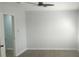 Spacious bedroom featuring neutral walls, wood-look floors, and a ceiling fan at 5582 Windwood Rd, Atlanta, GA 30349