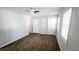 A light, airy bedroom with wood-look floors and a ceiling fan at 5582 Windwood Rd, Atlanta, GA 30349